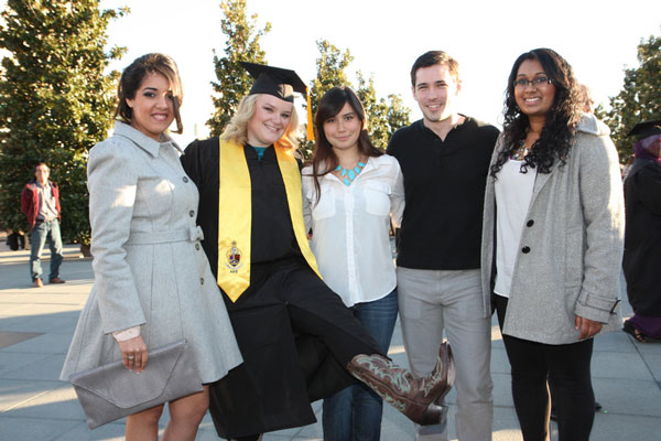 Alpha Kappa Psi members Archana Sharma, Elizabeth Goebel, Judit Guzman, Brad Phillips and Divya Raju posed for a photo after commencement. Goebel earned a bachelor’s degree in marketing from the Naveen Jindal School of Management.